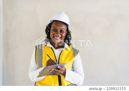 Senior professional African black female real estate foreman inspecting inside the building construction, foreman checking the under construction building. African female engineer inspects interior. 120912153