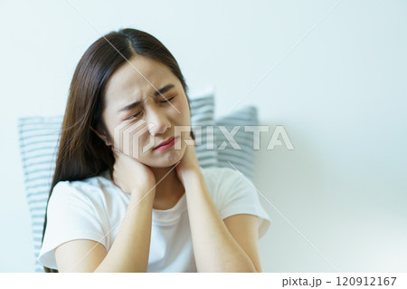 Unhappy - unwell Asian young woman having a mental health problem, woman feels uncomfortable after woke up from the bed. Young woman got a depression problem and mental burnout. Unhappy - unwell Asian young woman having a mental health problem, woman feels uncomfortable after woke up from the bed. Young woman got a depression problem and mental burnout. 120912167