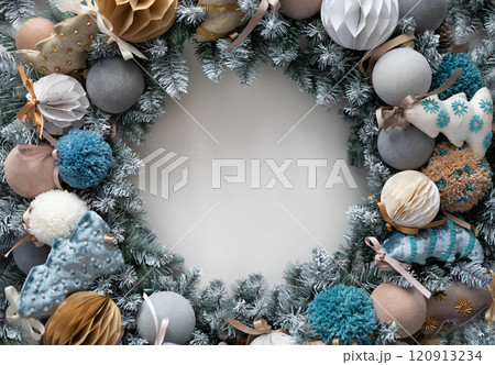 Christmas wreath made of live fir branches and toys on a white background, template for design 120913234