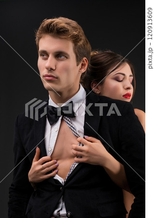Sexy couple embracing view on dark background Sexy couple embracing view on dark background 120913609