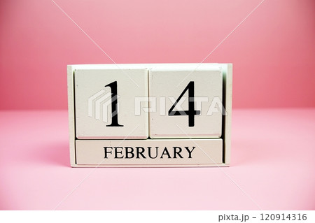 14 February wooden calendary on pink background Valentine's Day concept 120914316
