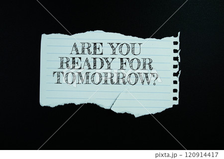 Are You Ready For Tomorrow? text on paper torn top view on black background Are You Ready For Tomorrow? text on paper torn top view on black background 120914417