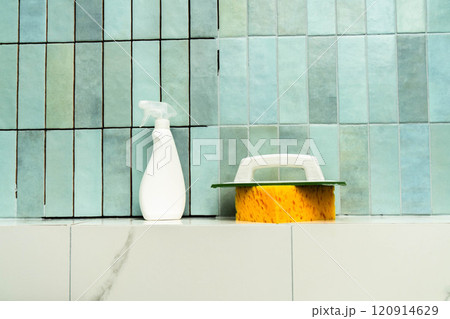 Tools and materials prepared for epoxy grout application in a tiled environment. 120914629