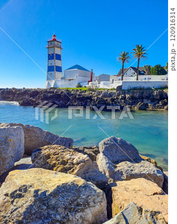 Santa Marta lighthouse in Cascais Portugal. Atlantic Ocean coast Santa Marta lighthouse in Cascais Portugal. Atlantic Ocean coast 120916314