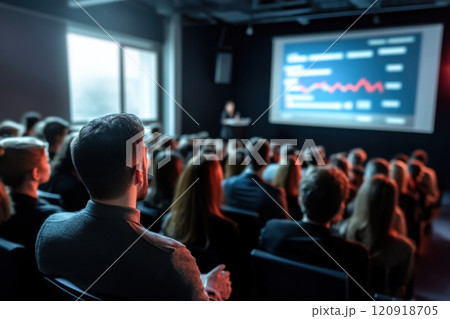 Audience watching business presentation with statistical chart in conference room 120918705