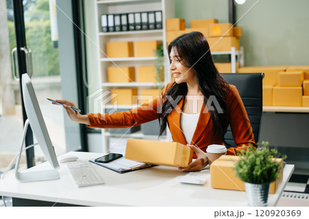 Startup small business SME, Entrepreneur owner woman using smartphone or tablet taking receive and checking Startup small business SME, Entrepreneur owner woman using smartphone or tablet taking receive and checking 120920369