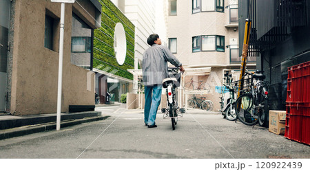 City, walking and back of Asian man with bicycle for commute, journey and explore town on weekend. Travel, cycling and person on bike for trip, sustainability and eco friendly transport in Japan City, walking and back of Asian man with bicycle for commute, journey and explore town on weekend. Travel, cycling and person on bike for trip, sustainability and eco friendly transport in Japan 120922439