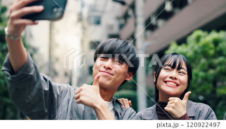Happy, asian couple and city with thumbs up for selfie, photography or memory together in street. Japanese, man and woman with yes sign or like emoji for moment or picture in an urban town in Tokyo 120922497