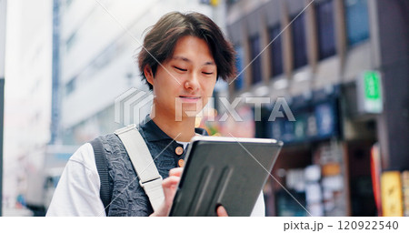 Research, travel and man with tablet, city and browsing for trends, online and commuting on street. Typing, digital and app for media strategist, website and planning for campaign, person and Japan 120922540
