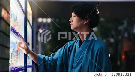 Night, vending machine and thinking with Japanese man in city for food decision, shopping and choice. Product, customer and menu with profile of person and dispenser for price, selection and press Night, vending machine and thinking with Japanese man in city for food decision, shopping and choice. Product, customer and menu with profile of person and dispenser for price, selection and press 120923321