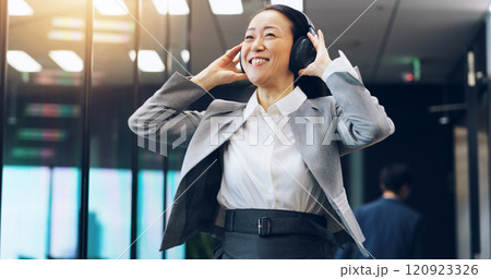 Woman, headphones and employee walking in office, hearing music and celebration of success. Female person, professional and morning dancing in workplace for achievement, listening and sound in Japan Woman, headphones and employee walking in office, hearing music and celebration of success. Female person, professional and morning dancing in workplace for achievement, listening and sound in Japan 120923326
