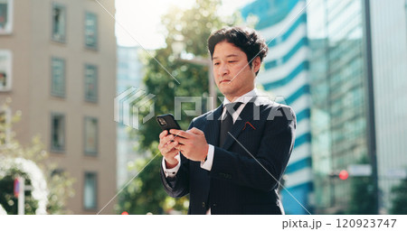 Man, reading and phone in city for business, travel and research for urban development in Tokyo. Mature investor, mobile and scroll in Japanese town for news, investment opportunity or economy growth 120923747