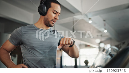 Fitness, gym and man with time, music and heart rate check with treadmill and runner stats. Stopwatch, run and wellness app with exercise, training and pulse tracking for workout with monitor tech 120923748