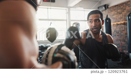 Boxing, man and personal trainer in gym with workout, power and training for sport and strength in wellness club. Coach, health and sweating athlete and boxer with exercise for fight and match Boxing, man and personal trainer in gym with workout, power and training for sport and strength in wellness club. Coach, health and sweating athlete and boxer with exercise for fight and match 120923761