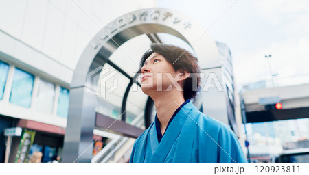 Man, thinking and metro travel with traditional clothes, outfit and yukata for heritage. Japanese guy, holiday and pride for culture, journey and sightseeing with casual dress kimono fashion in city 120923811