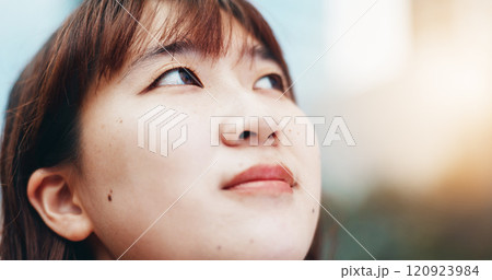 Japanese woman, thinking and travel in city with reflection, sunshine and sightseeing in summer. Person, outdoor and perspective in urban street for commute, tourism or search for location in town 120923984