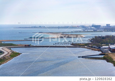 Copenhagen seacoast city skyline with Amager beach park, airport and wind farm in background, sunny spring day, Denmark 120928162