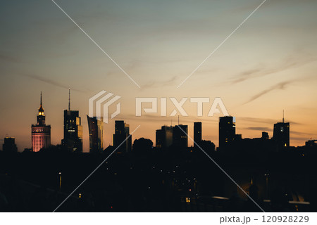 panorama of Warsaw city skyline at sunset, skyscrapers of downtown silhouette, blue sky on background, capital of Poland business district 120928229