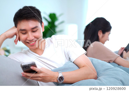 Problem in modern lifestyle young family or couple, they separate - ignoring each other and always playing a smartphone devices.  120928600