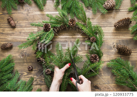 Making Christmas wreath using fresh and all natural materials. Flat lay. Top view. Making Christmas wreath using fresh and all natural materials. Flat lay. Top view. 120933775