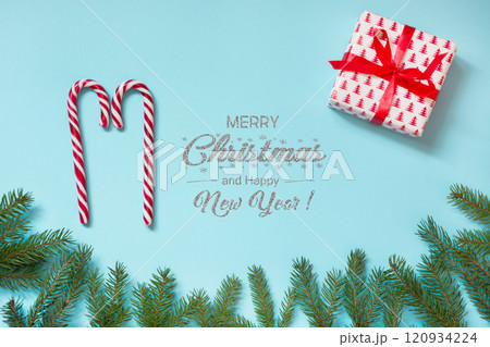 Christmas creative workplace with gift, snowflakes red paper on blue. Xmas card. Christmas creative workplace with gift, snowflakes red paper on blue. Xmas card. 120934224