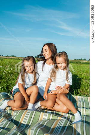 appy kid  and mom are kissing and hugging.Family weekend concept. 120935062