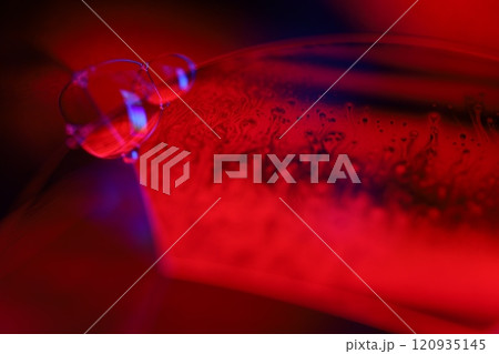 Red and blue fluid reflections on black background, liquid abstraction, colour waves, deep dark backgrounds, geometric water shapes Red and blue fluid reflections on black background, liquid abstraction, colour waves, deep dark backgrounds, geometric water shapes 120935145