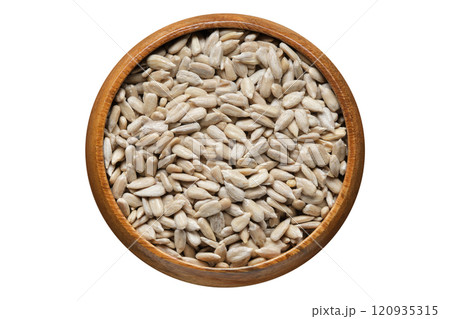 Top View of Shelled Sunflower Seeds in Wooden Bowl 120935315
