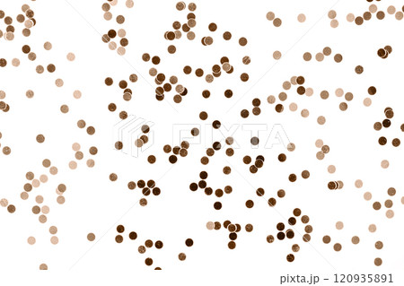 Brown confetti scattered on a white background for festive celebrations 120935891