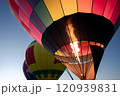 Hot air balloons lift off into the dawn sky 120939831