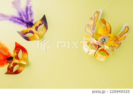 Happy Purim carnival accessories. Top view carnival mask for Mardi Gras celebration isolated on pastel green background, jewish holiday, Purim in Hebrew holiday Happy Purim carnival accessories. Top view carnival mask for Mardi Gras celebration isolated on pastel green background, jewish holiday, Purim in Hebrew holiday 120940320