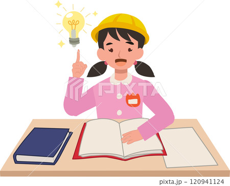 young preschool girl in japanese uniform sitting at a desk with inspiration concept 120941124