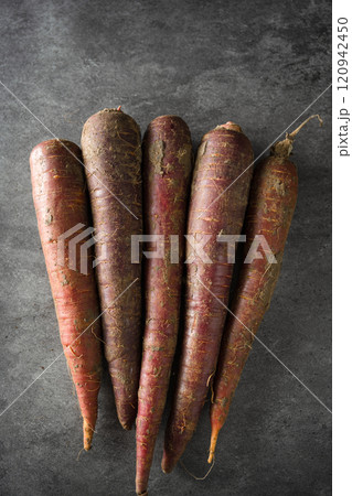 fresh raw organic carrots on dark background fresh raw organic carrots on dark background 120942450