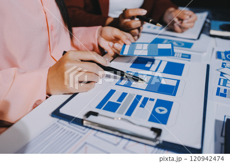 Young Asian business creative team work together, mobile application software design project. Brainstorm meeting, internet technology, smartphone web app designer, office coworker teamwork concept 120942474