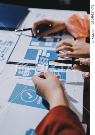 Young Asian business creative team work together, mobile application software design project. Brainstorm meeting, internet technology, smartphone web app designer, office coworker teamwork concept 120942475