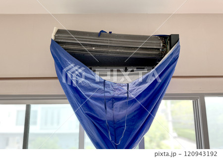 Cleaning and washing dirty air conditioner vent, dirty old air vent covered with a dust. Cleaning air conditioner by professional technician. Cleaning and washing dirty air conditioner vent, dirty old air vent covered with a dust. Cleaning air conditioner by professional technician. 120943192