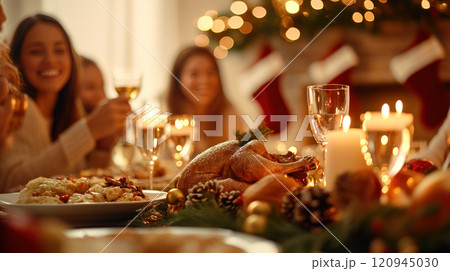 joyful family gathering around festive dinner table, celebrating Christmas Eve joyful family gathering around festive dinner table, celebrating Christmas Eve 120945030