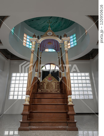 Ornately decorated minbar pulpit from where prayers are led standing on a platform at Safirusslam Mosque. Ornately decorated minbar pulpit from where prayers are led standing on a platform at Safirusslam Mosque. 120950616