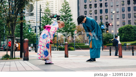 Respect, japanese people and bow for greeting, culture and welcome with kimono in city. Traditional fashion, man and woman with introduction in urban town for honor, departure and farewell custom 120951219