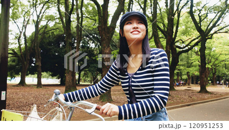 Park, woman and happy for walking with bicycle for travel, transportation and carbon footprint in Japan. Outdoor, female person and smile at forest on break with bike for self care and relax 120951253