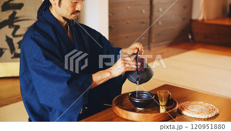 Man, relax and tea ceremony for culture, tradition and matcha in home with preparation in Japan. Male person, ritual and bowl for mindfulness, zen and buddhism with spiritual, respect and harmony Man, relax and tea ceremony for culture, tradition and matcha in home with preparation in Japan. Male person, ritual and bowl for mindfulness, zen and buddhism with spiritual, respect and harmony 120951880