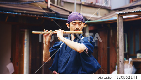 Japanese man, flute and music for practice, reflection and zen sound for Shinto meditation. Sensei person, bamboo and fue instrument for tradition, culture and spiritual heritage with shinobue Japanese man, flute and music for practice, reflection and zen sound for Shinto meditation. Sensei person, bamboo and fue instrument for tradition, culture and spiritual heritage with shinobue 120952141