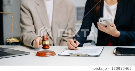 Business and lawyers discussing contract papers with brass scale on desk. Law, legal services, advice, justice and law concept . Business and lawyers discussing contract papers with brass scale on desk. Law, legal services, advice, justice and law concept . 120953463