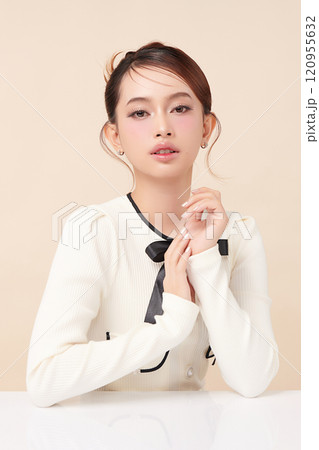 Beautiful young asian woman with clean fresh skin on beige background, Face care, Facial treatment, Cosmetology, beauty and spa, Asian women portrait. 120955632