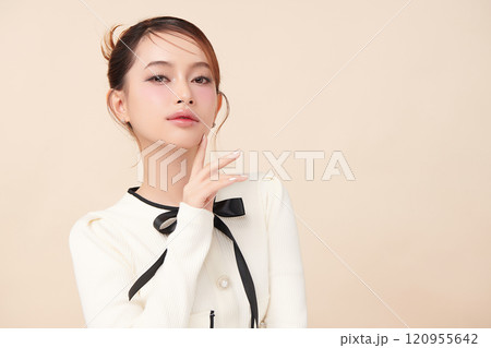 Beautiful young asian woman with clean fresh skin on beige background, Face care, Facial treatment, Cosmetology, beauty and spa, Asian women portrait. Beautiful young asian woman with clean fresh skin on beige background, Face care, Facial treatment, Cosmetology, beauty and spa, Asian women portrait. 120955642