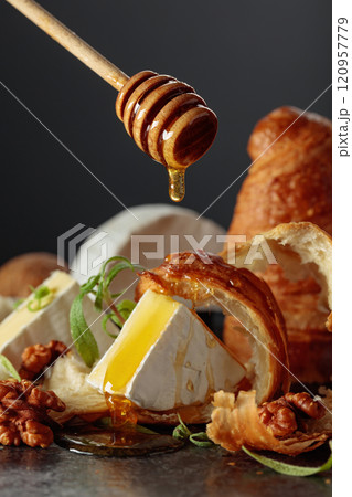 Camembert cream cheese with honey, croissants, and walnuts. Camembert cream cheese with honey, croissants, and walnuts. 120957779