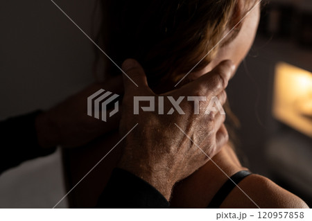 Close-up of male hands doing lymphatic drainage massage on a female neck. Close-up of male hands doing lymphatic drainage massage on a female neck. 120957858