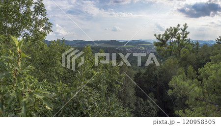 Panoramic view from viewpoint Stredni vrch near Dolni Prysk, Ceska Kamenice. Autumn landscape with colorful forest, hills and blue cloudy sky in Luzicke hory Lusatian Mountains, Czech Republic. Panoramic view from viewpoint Stredni vrch near Dolni Prysk, Ceska Kamenice. Autumn landscape with colorful forest, hills and blue cloudy sky in Luzicke hory Lusatian Mountains, Czech Republic. 120958305