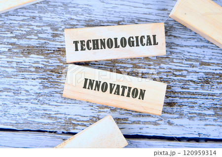 Technological innovation displayed with wooden blocks on a rustic wooden surface during a creative workshop 120959314