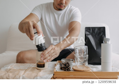 Step by step of man making espresso with hand press tools. Step by step of man making espresso with hand press tools. 120959638